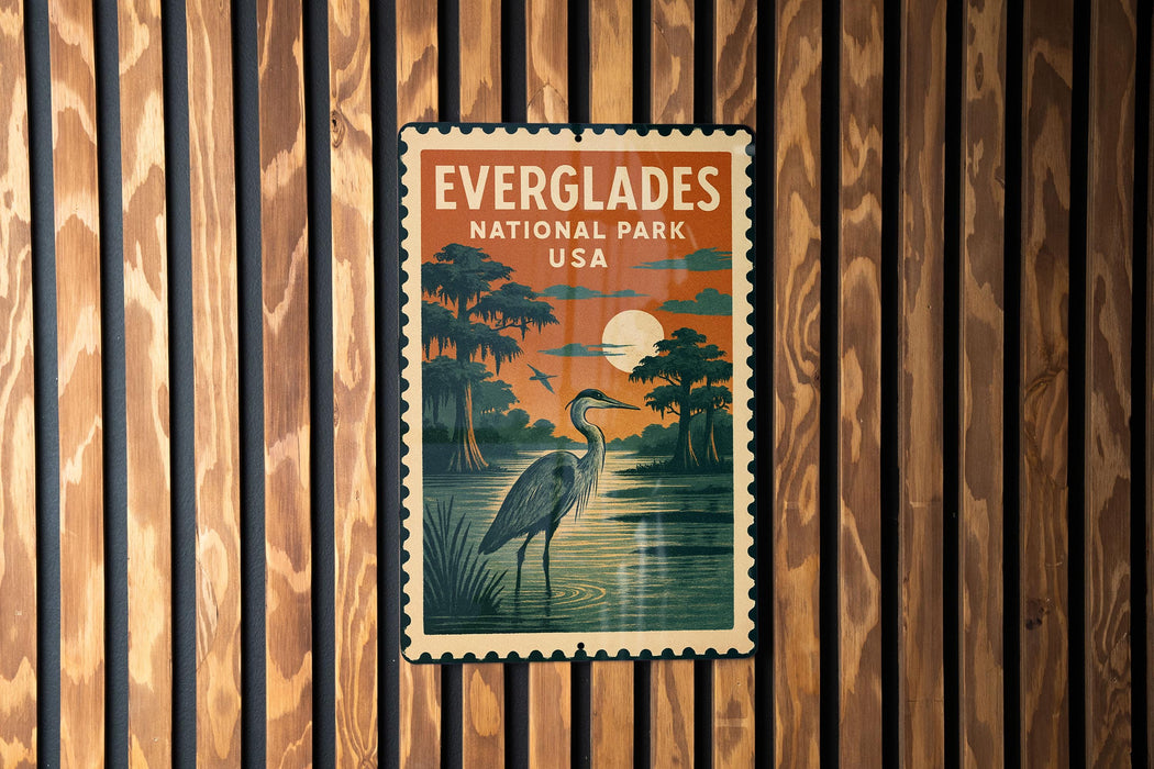 A vintage Everglades National Park postage stamp is displayed on a wooden wall.