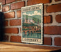 A vintage-style metal stamp depicting the Heidelberg Castle in Germany, with a bridge and river in the background.