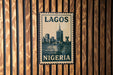 A vintage postage stamp featuring the cityscape of Lagos, Nigeria, with the text "LAGOS NIGERIA" prominently displayed.