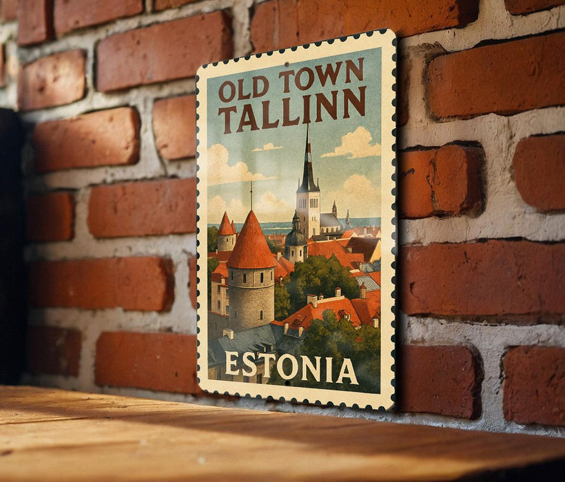 A vintage-style poster of Tallinn, the capital city of Estonia, displayed on a brick wall.