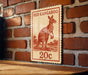 A red kangaroo stamp is displayed on a brick wall, with the text "RED KANGAROO" and "20c" printed on it.