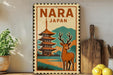 A vintage-style poster of Nara, Japan, featuring a pagoda and a deer, is displayed on a wall next to a wooden cutting board and a potted plant.
