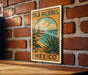A vintage-style poster of the island of Isla Mujeres, Mexico, featuring a desert landscape with a cactus plant and a cloudy sky.
