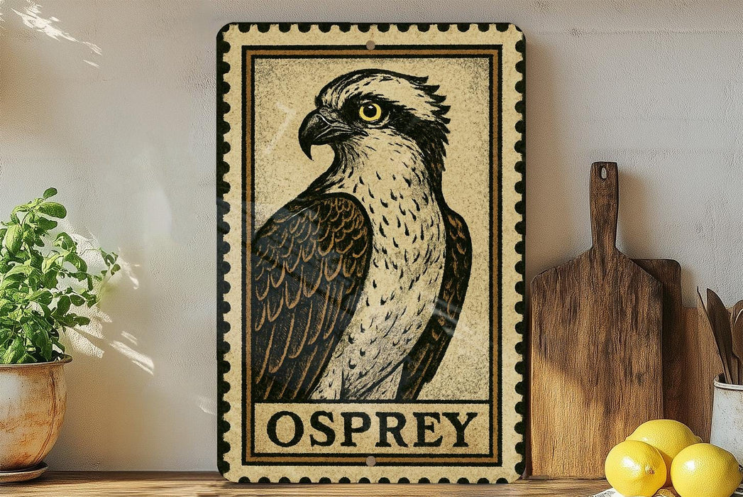 a framed illustration of an Osprey, a bird of prey, on a shelf next to a wooden cutting board and some lemons.