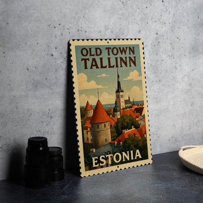 A vintage-style metal sign with the text "OLD TOWN TALLINN" and "ESTONIA" printed on it, depicting a cityscape with a castle-like structure.