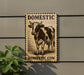 a sign that reads "Domestic Cow" with a cow illustration on it.