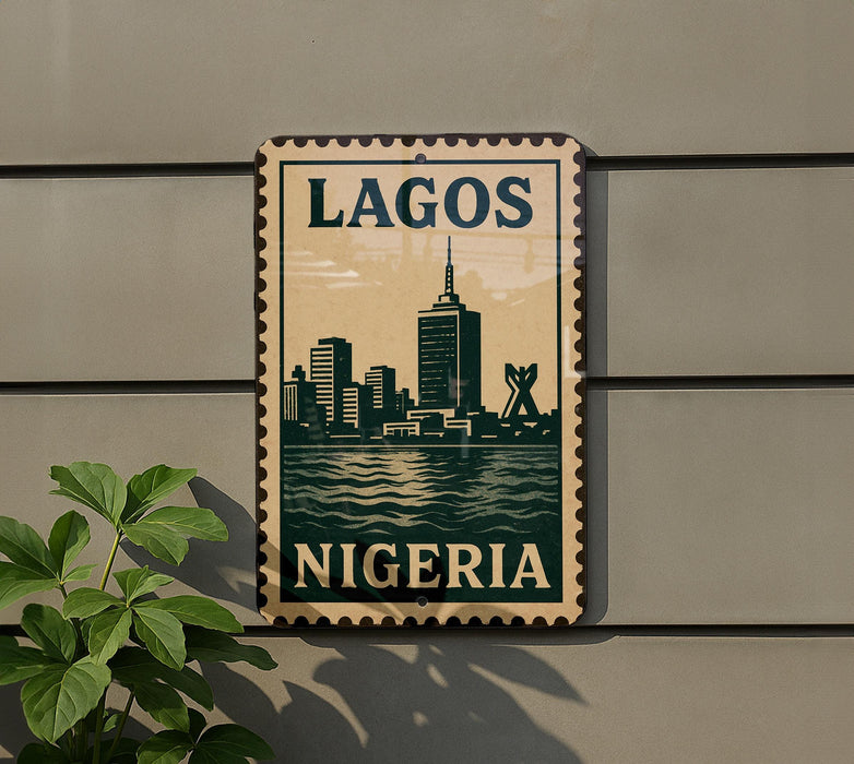 A postage stamp-style sign displaying the city of Lagos, Nigeria, with a silhouette of the city skyline and a river in the background.