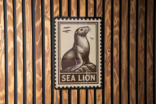 A sea lion stamp is displayed on a wooden wall.