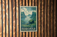 A postage stamp from Føroyar, a country in Norway, is displayed on a wooden wall.