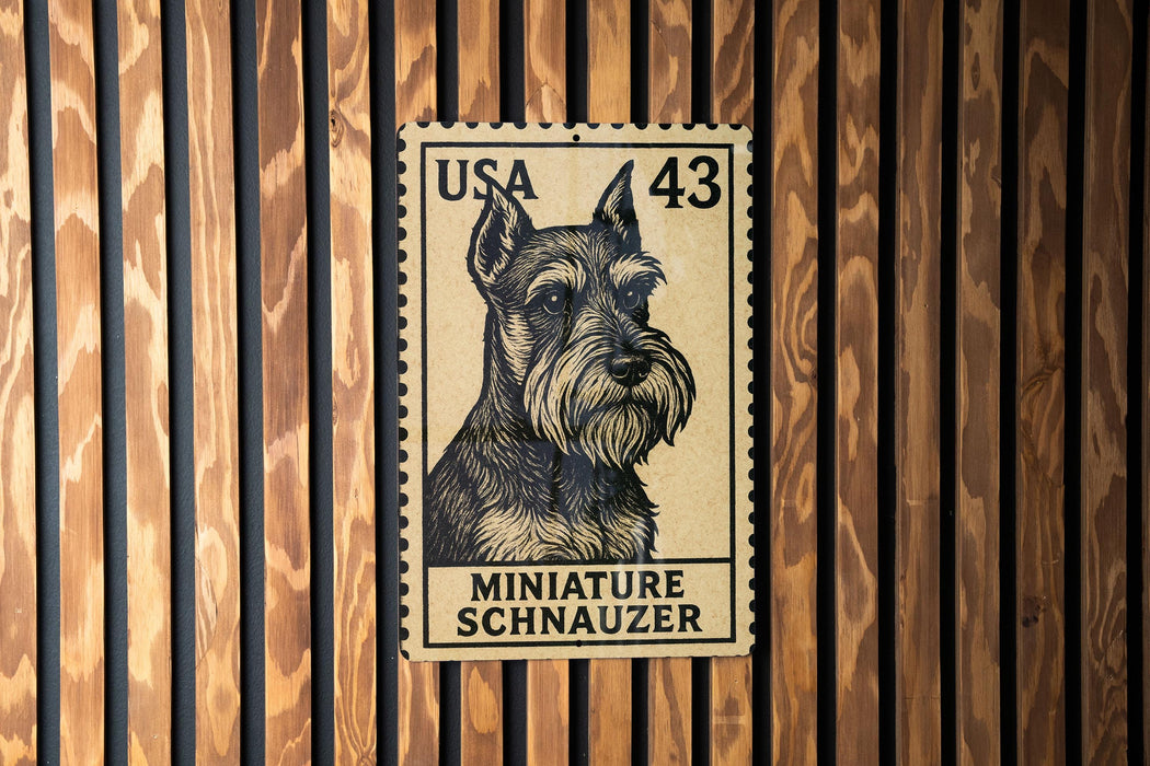 A miniature schnauzer dog stamp is displayed on a wooden wall.