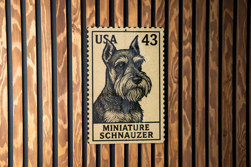 A miniature schnauzer dog stamp is displayed on a wooden wall.