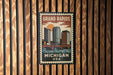 A vintage-style postage stamp depicting the Grand Rapids, Michigan, USA, with a cityscape and a bridge.