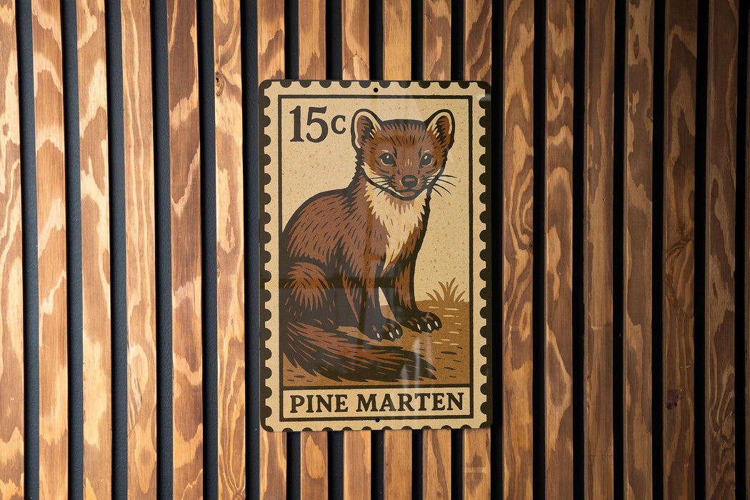 A 15 cent postage stamp featuring a pine marten, a small brown and white mammal, is affixed to a wooden wall.