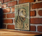 A vintage-style postage stamp featuring an illustration of an Irish wolfhound dog, with the number 5 below it.