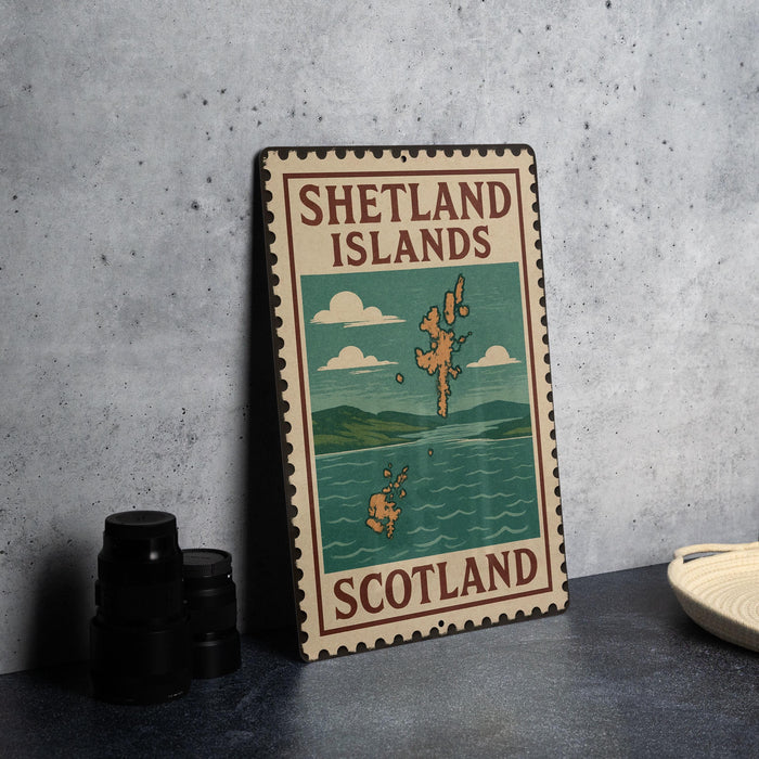 A vintage-style metal sign with the text "SHELTLAND ISLANDS SCOTLAND" and an illustration of a map of Scotland, along with a small boat, is displayed on a gray countertop.