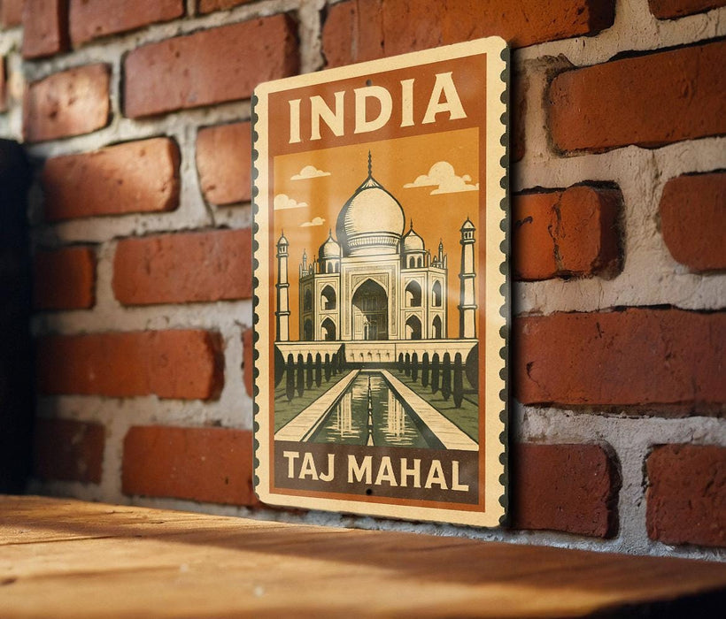 A vintage-style metal sign with the text "INDIA Taj Mahal" and an illustration of the Taj Mahal, a famous mausoleum in India.