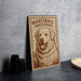 A wooden sign featuring a large illustration of a dog, with the text "Maremma Sheepdog" printed on it.