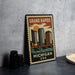 A vintage-style metal sign with a cityscape and the text "GRAND RAPIDS MICHIGAN USA" printed on it, placed on a gray countertop next to some black camera lenses.