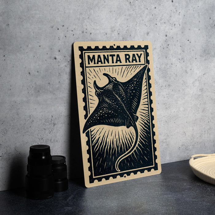 a framed print of a manta ray, a type of ray, with the text "MANTA RAY" on it.