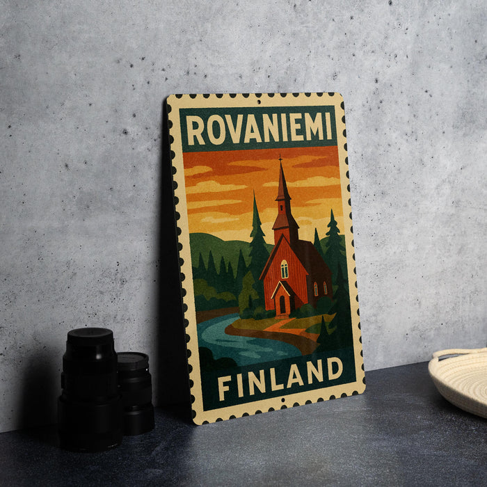A metal sign with a vintage-style illustration of a church and a river, along with the text "ROVANIemi Finland" on it, is displayed on a table.