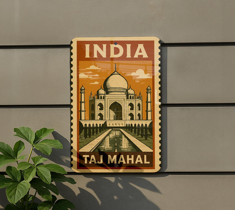 A vintage-style sign depicting the Taj Mahal, a famous mausoleum in India, mounted on a wall.