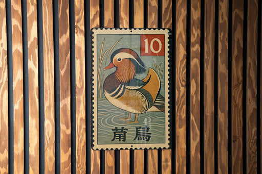 A metal stamp featuring a colorful illustration of a bird, likely a duck, with the number 10 and some text in a foreign language.