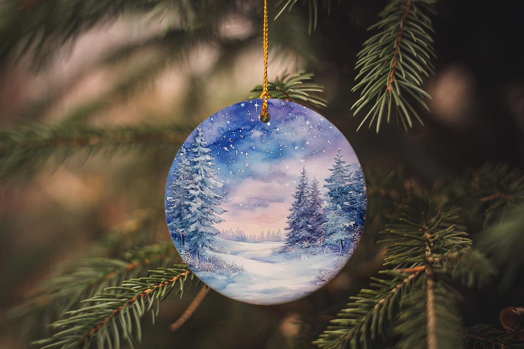 a glass ornament hanging from a christmas tree