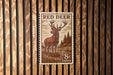 A postage stamp featuring a red deer, with the text "RED DEER" and "8cents" printed on it.