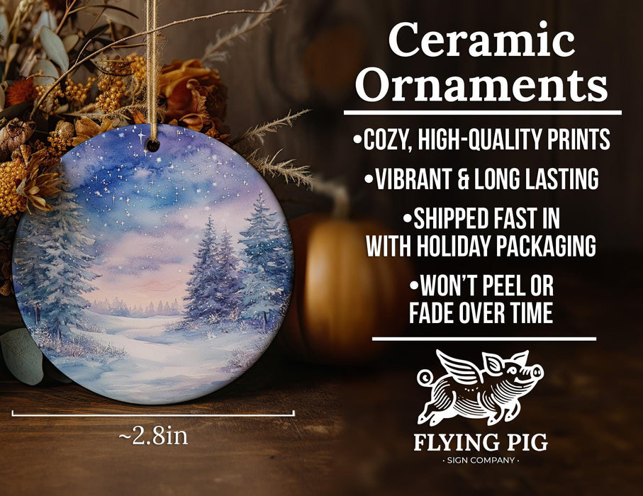 a ceramic ornament with a snowy scene on it