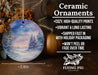 a ceramic ornament with a snowy scene on it