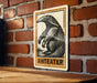A metal sign featuring an illustration of an ant eater is mounted on a brick wall.
