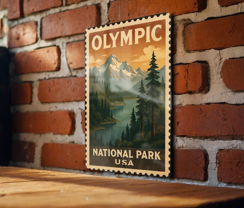 A vintage-style poster of Olympic National Park in the United States, featuring a mountain landscape with pine trees and a lake.