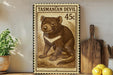 A framed stamp depicting a Tasmanian Devil, a small marsupial native to Australia, is displayed on a shelf next to a wooden cutting board and a potted plant.
