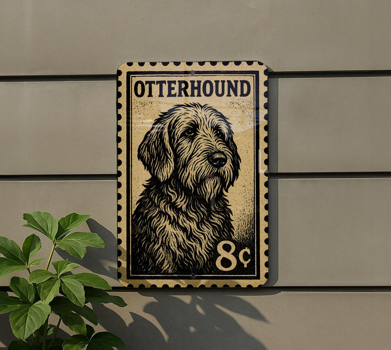 A metal sign featuring a dog's portrait, mounted on a wall next to a plant.