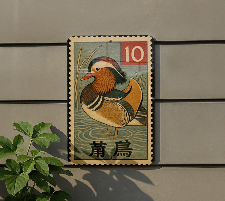 A vintage postage stamp featuring a colorful bird, likely a mandarin duck, is displayed on a wall.