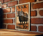 A wooden table with a 20-cent postage stamp featuring a yak illustration on it, mounted on a brick wall.