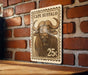 A metal sign with a buffalo illustration and the text "CAPE B Buffalo" is mounted on a brick wall.