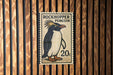 A postage stamp featuring a penguin, with the text "ROCKHOpper PENGUIN" and the denomination "20c".