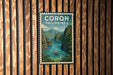 A vintage-style poster of Coron Philippines, featuring a scenic landscape with mountains, water, and a boat, is displayed on a wooden wall.