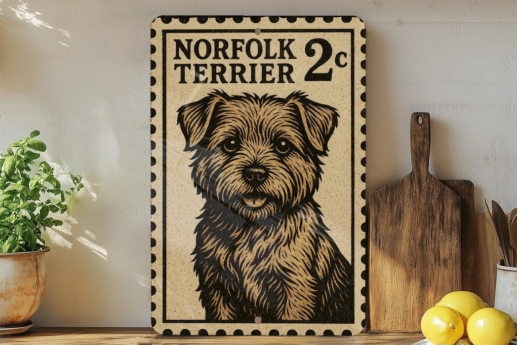 a framed poster of a dog, specifically a Norfolk Terrier, with a price tag of 2 cents. The poster is displayed on a shelf next to a wooden cutting board and some lemons.