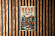A metal sign with the text "Reno, Nevada, USA" and an illustration of a cityscape with mountains in the background.