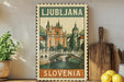 A vintage-style stamp depicting the city of Ljubljana, Slovenia, with a bridge and buildings in the background.