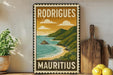 A vintage-style metal sign with the text "RODRIGUE" and "Mauritius" printed on it, depicting a tropical beach scene with mountains and a blue ocean.