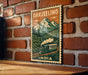 A vintage-style poster of a train traveling through a mountainous landscape, with the text "DARJEELING" and "INDIA" prominently displayed.