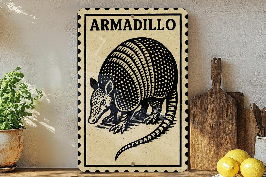 A metal sign with the word "ARMADillo" on it, featuring a detailed illustration of an armadillo. The sign is displayed on a shelf next to a wooden cutting board and a potted plant.