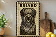 a decorative sign with a black and white illustration of a dog's face, placed on a wooden surface next to a wooden cutting board and some lemons.