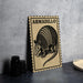 A wooden sign with the word "ARMADillo" printed on it, featuring an illustration of an armadillo.