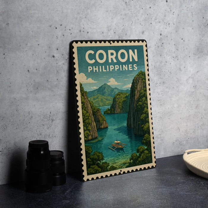 A framed poster of a scenic view of Coron, Philippines, featuring a boat on the water and lush green mountains in the background.
