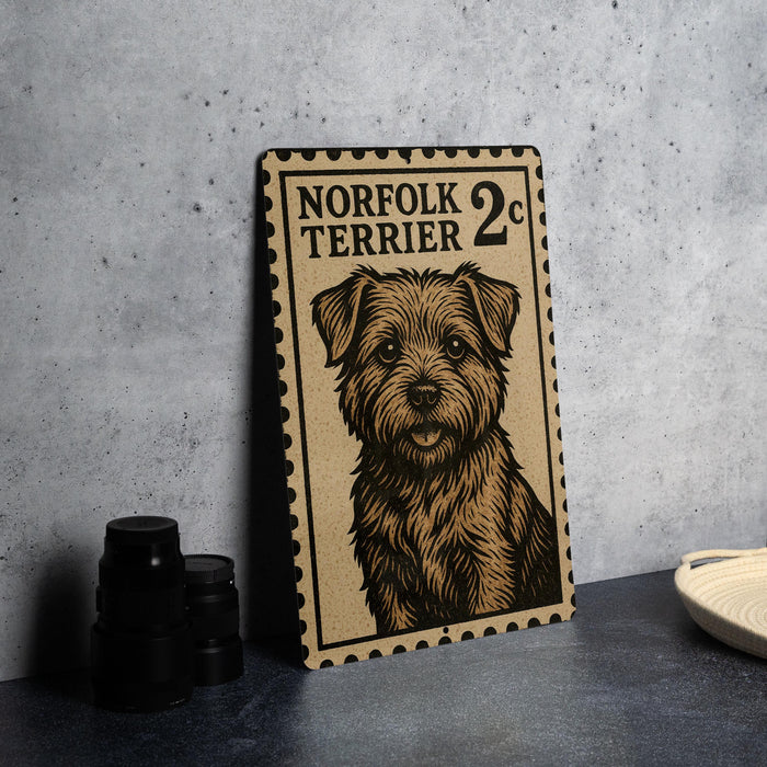 a metal sign with a dog illustration, placed on a table next to some black camera lenses.