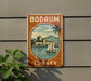 A vintage-style sign for Bodrum, Turkey, featuring a castle, palm trees, and a sailboat on the water.